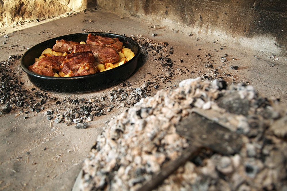 meat with potatoes roasting